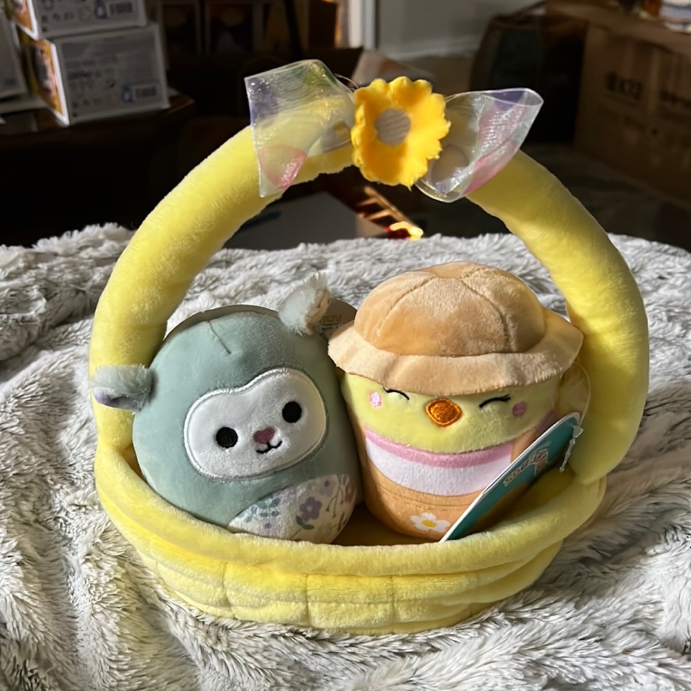 Relinda the Lamb and Aimee the Duck Squishmallows in a Easter basket.